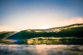 Beautiful sunrise over the ocean with wave at Byron Bay